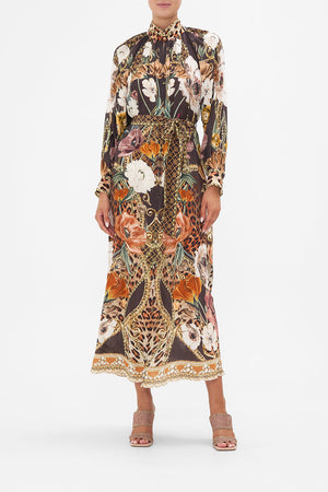 Front view of model wearing CAMILLA brown silk floral shirt dress in Wave Your Wand print