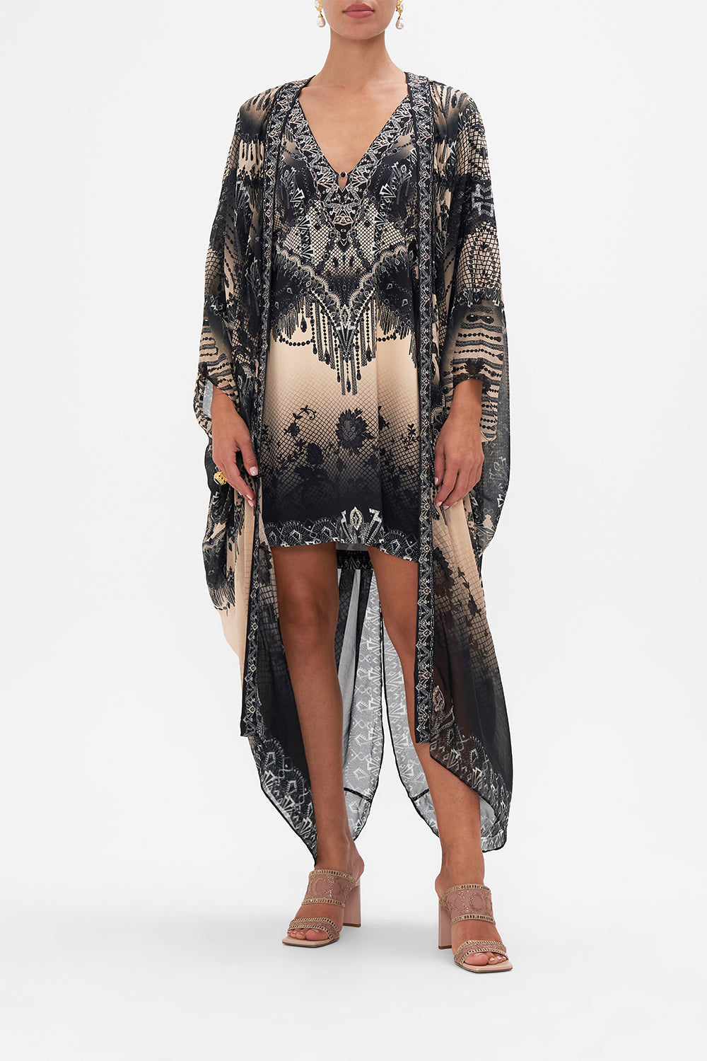 Front view of model wearing CAMILLA silk cape in Curtain Call Chaos print