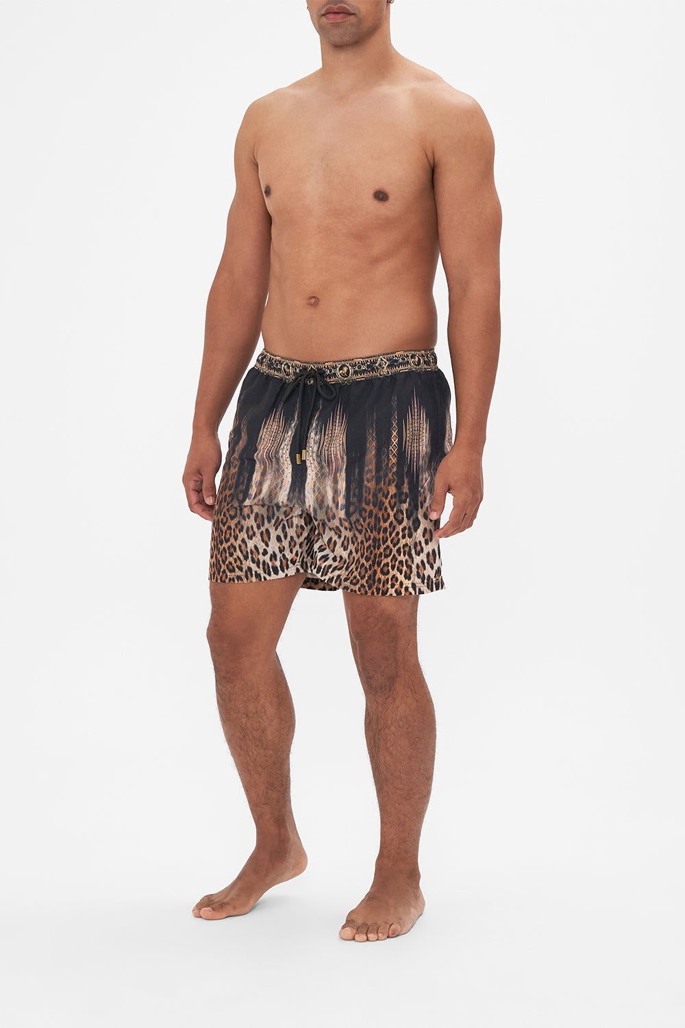 Side view of model wearing Hotel Franks by CAMILLA mens animal print boardshorts in Jungle Dreaming print