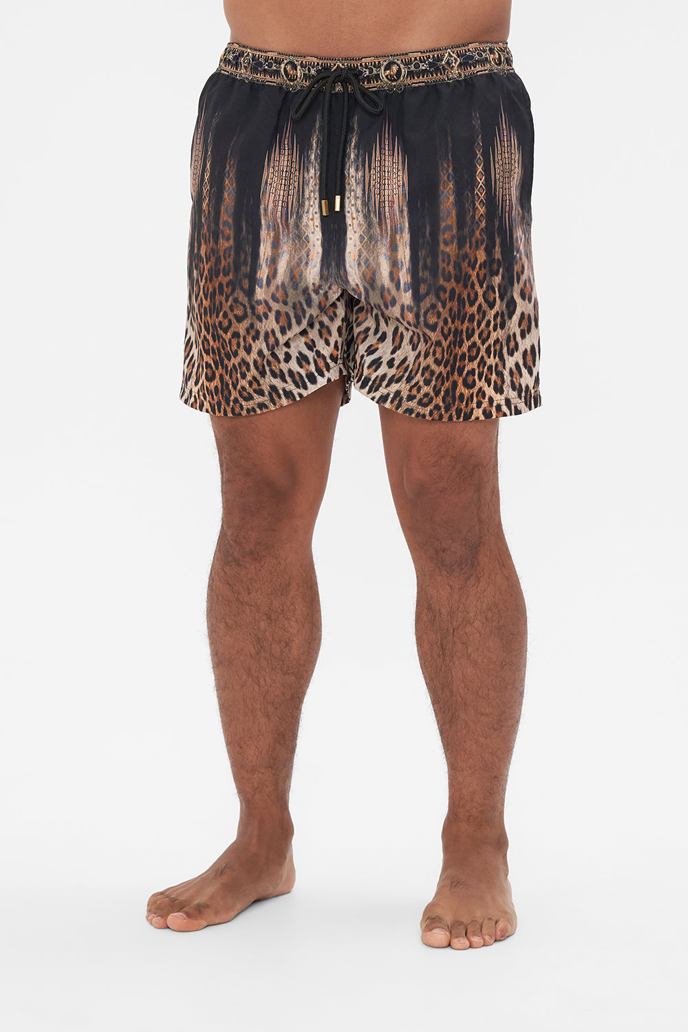Crop view of model wearing Hotel Franks by CAMILLA mens animal print boardshorts in Jungle Dreaming print