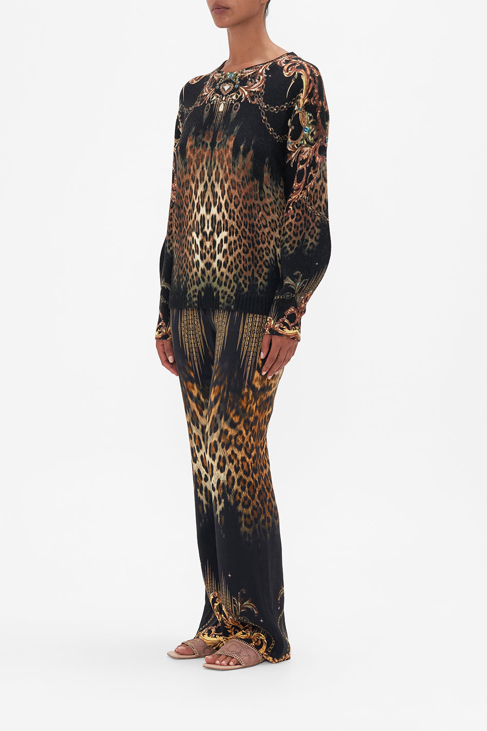 Side view of model wearing CAMILLA leopard print wool jumper in Jungle Dreaming print