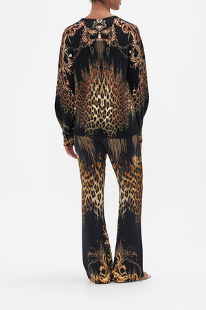 Back view of model wearing CAMILLA leopard print wool jumper in Jungle Dreaming print