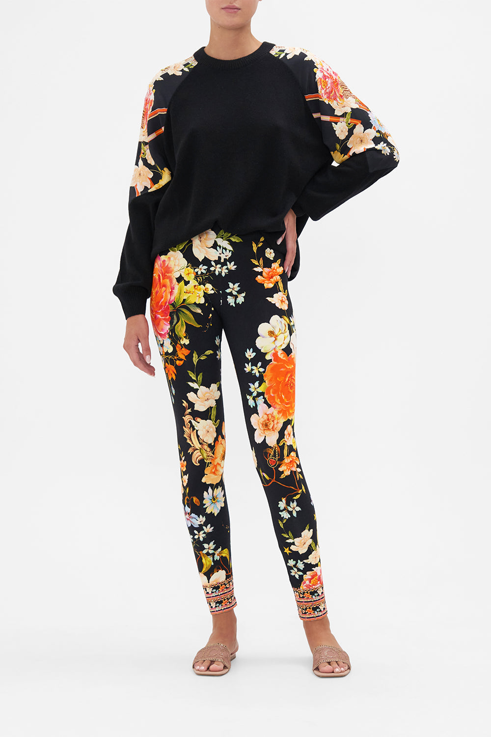 Front view of model wearing CAMILLA leggings in Secret History print