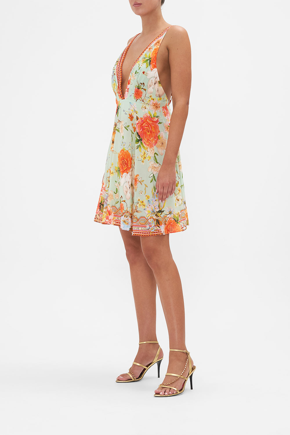 Side view of model wearing CAMILLA silk floral mini dress in Talk The Walk  print