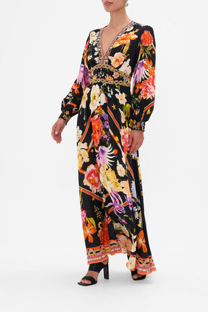 Side view of model wearing CAMILLA silk maxi dress in Secret History floral print