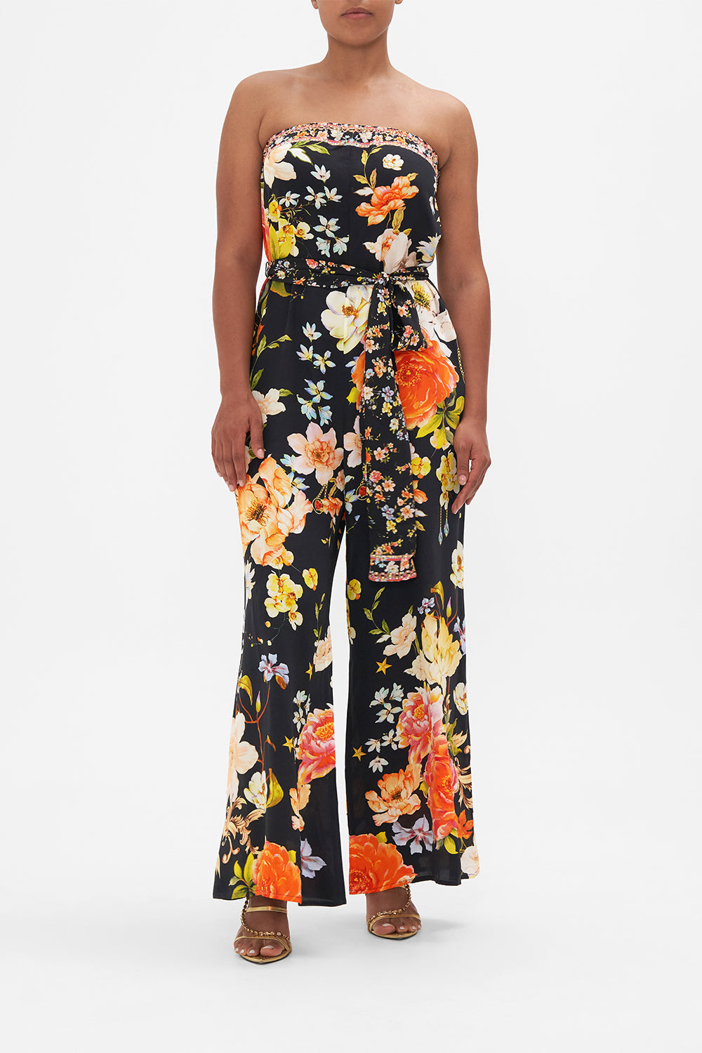Front view of model wearing CAMILLA strapless floral silk jumpsuit in Secret History print