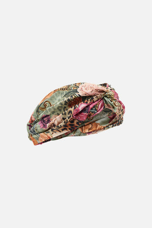 Detail view of CAMILLA silk twist front headband in floral Grow and Glow print 