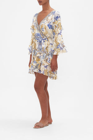 Side view of model wearing CAMILLA silk wrap dress in Soul Searching print