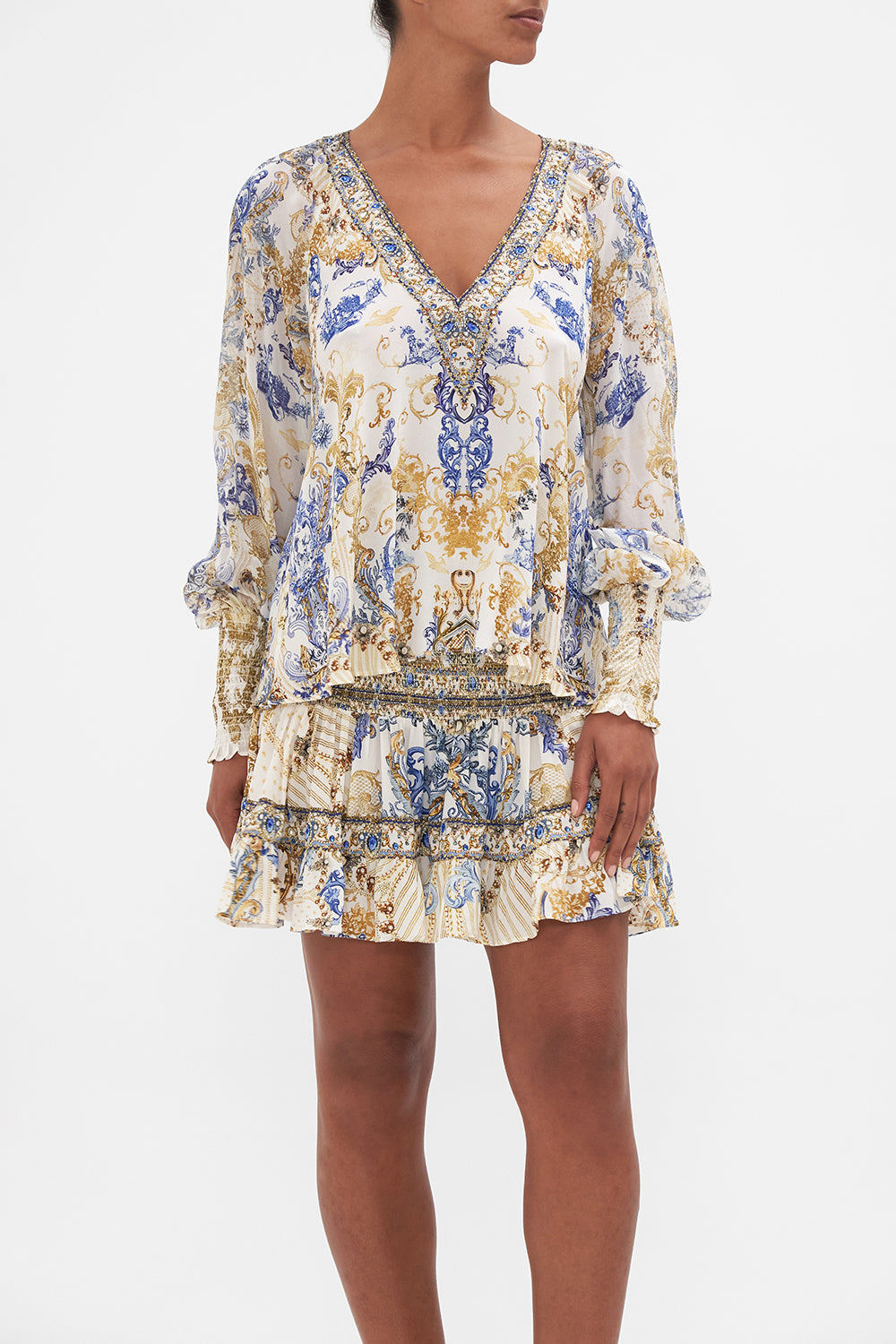 Crop view of model wearing CAMILLA silk blouse in Soul Searching print