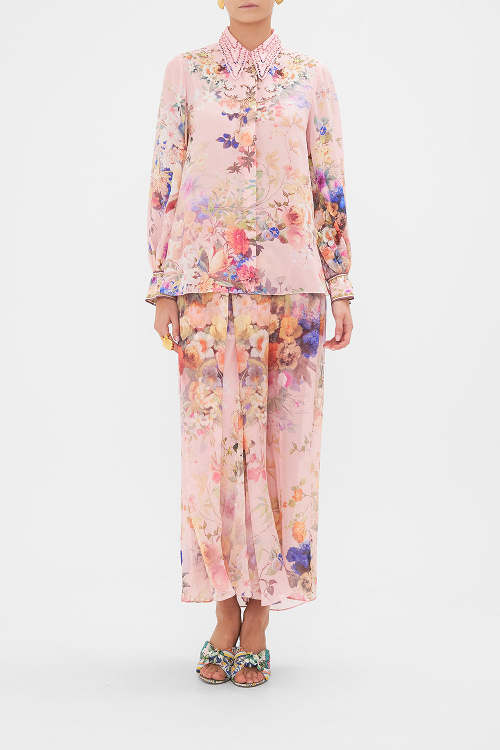 Front view of model wearing CAMILLA silk blouse in Letters from the Pink Room print