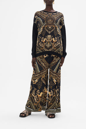 Front view of model wearing CAMILLA black and gold jumper in Duomo Dynasty print