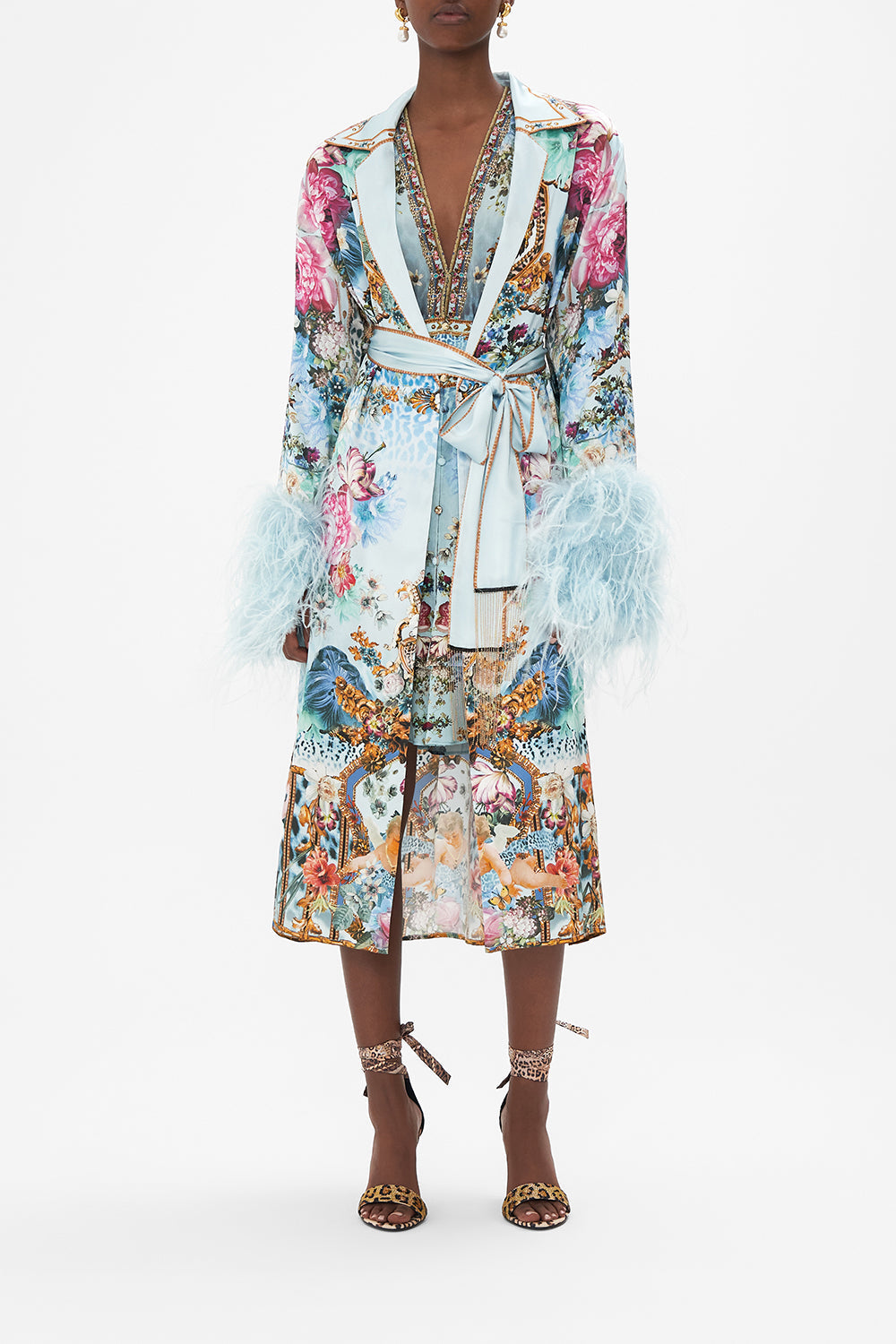 Front view of model wearing CAMILLA silk coat with feathers in Letters To Leo print