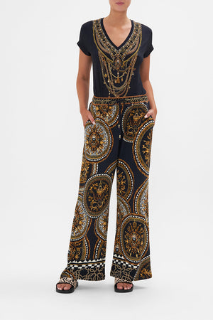 Front view of model wearing CAMILLA printed trackpants in Duomo Kaleido print