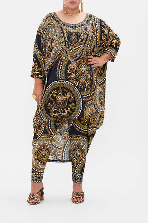 Front view of curvy model wearing CAMILLA plus size leggings in Duomo Dynasty print
