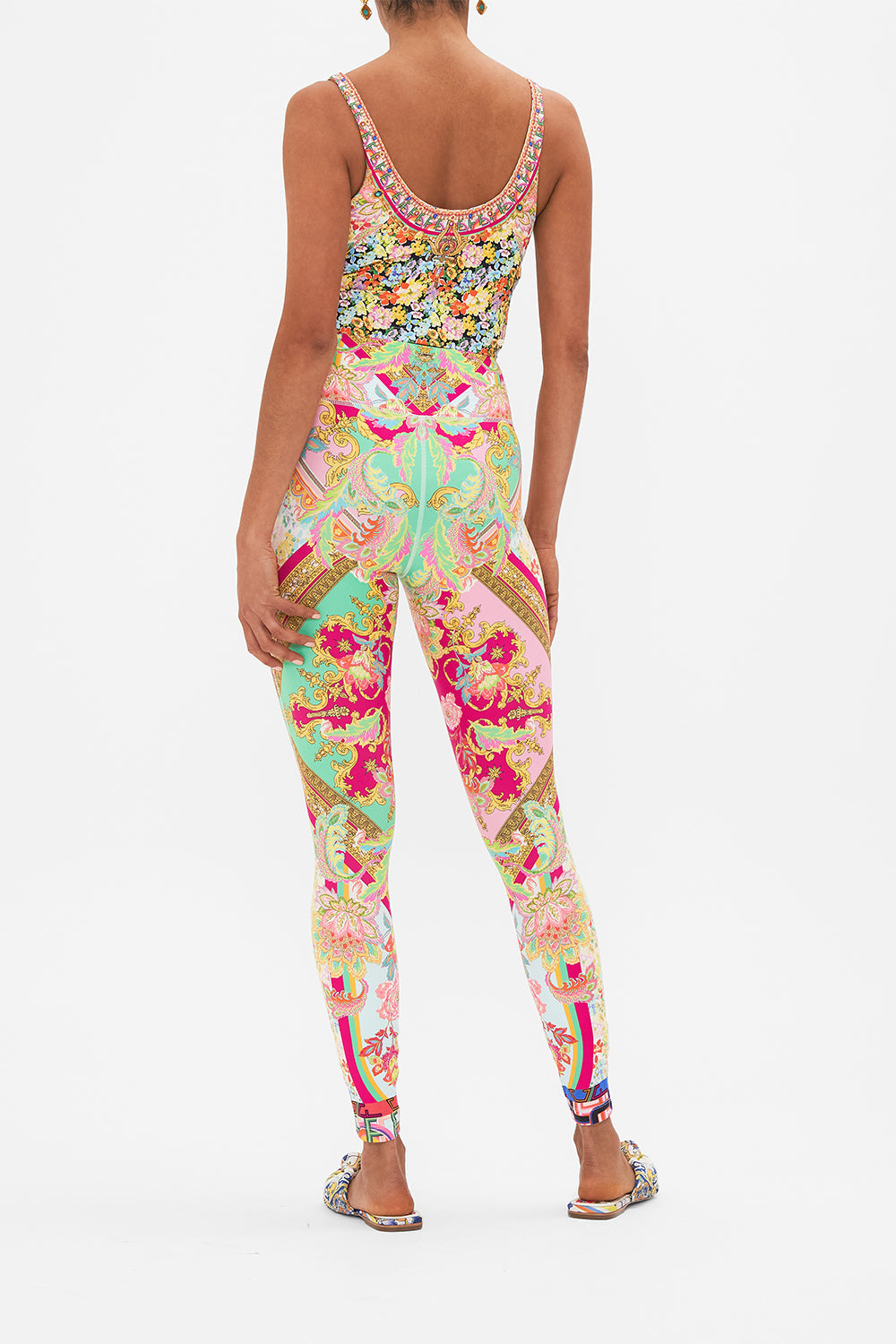 Back view of model wearing CAMILLA printed activewear crop tank in Ciao Bella print