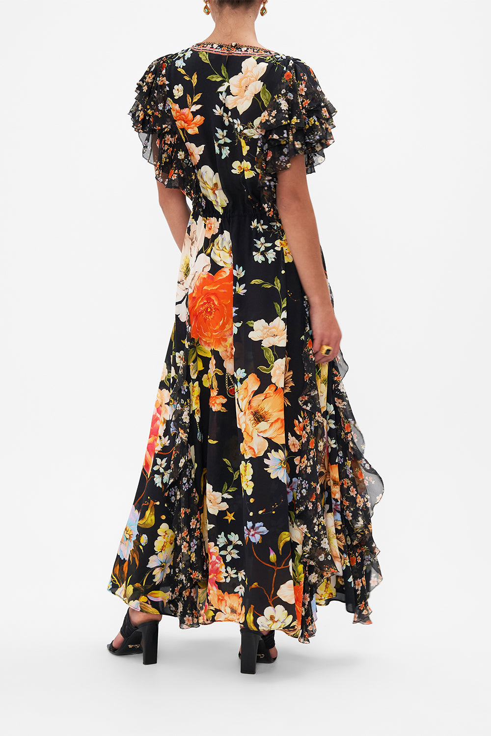 Back view of model wearing CAMILLA silk ruffle maxi dress in Secret History floral print