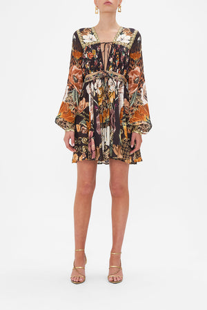 Front view of model wearing CAMILLA brown floral mini dress in Wave Your Wand print