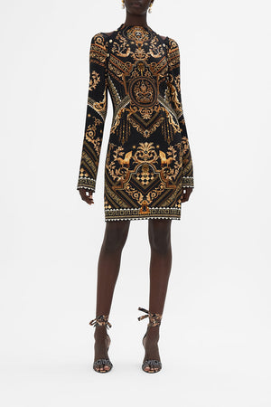 Front view of model wearing CAMILLA black and gold mini dress in Duomo Dynasty print
