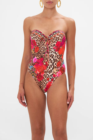 Crop view of model wearing CAMILLA resortwear one piece swimsuit in Heart Like A Wildflower print