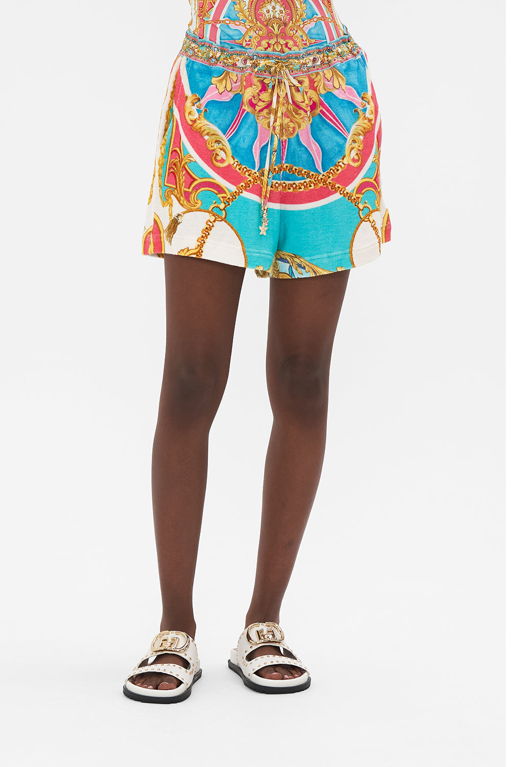 Crop view of model wearing CAMILLA silk boxer short in Sail Away With Me print 