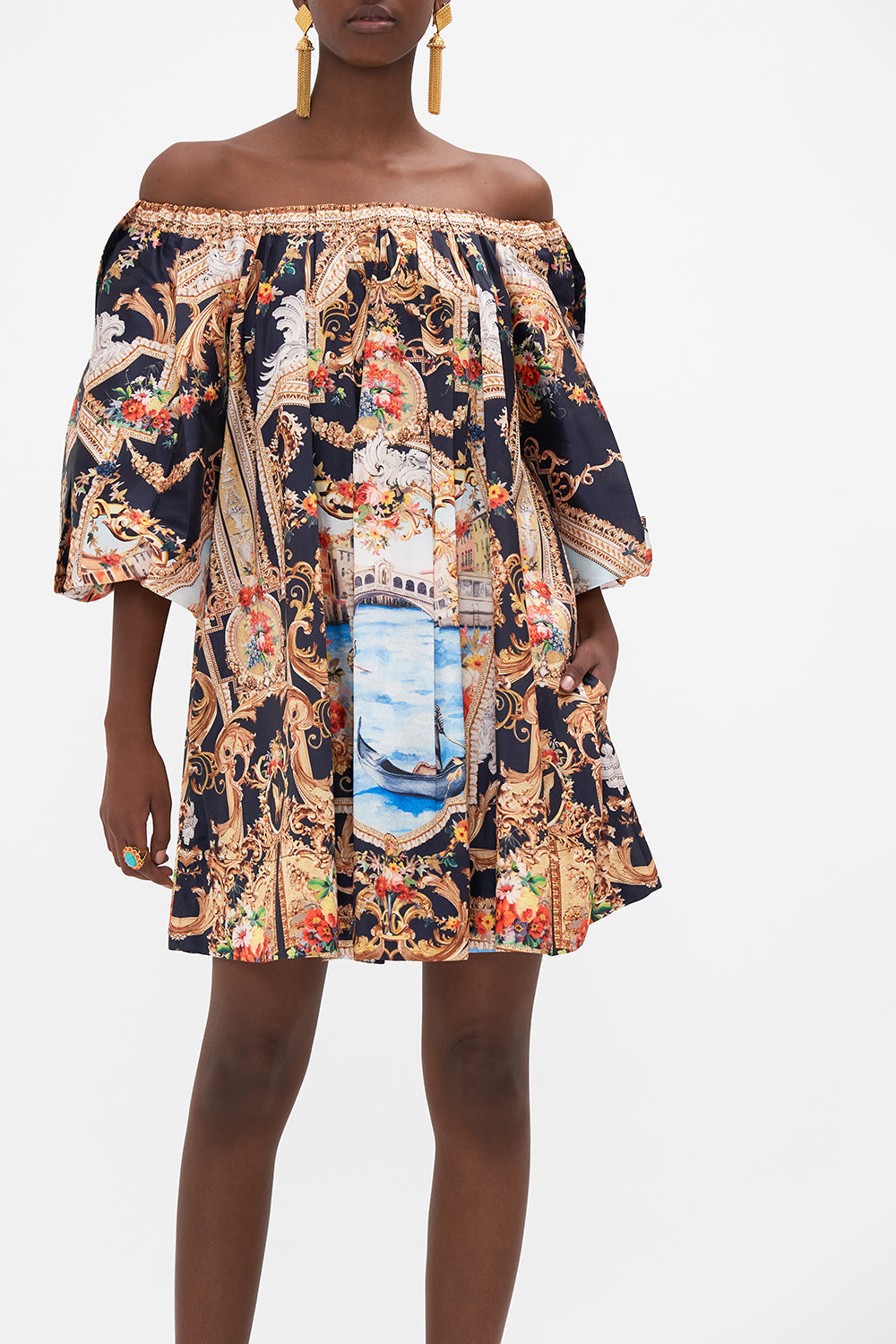 Crop view of model wearing CAMILLA off the shoulder mini dress in Venice Vignette print