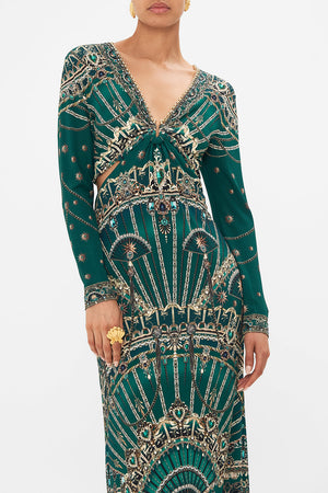 Crop view of model wearing CAMILLA cut out green jersey dress in A Venice Veil print