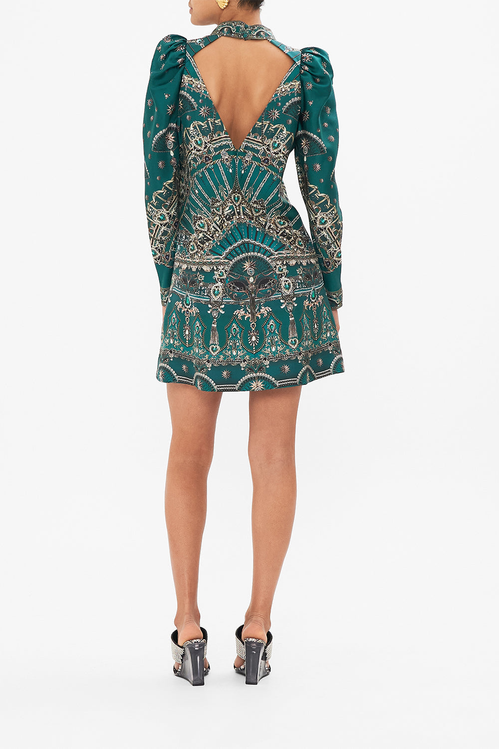 Back view of model wearingCAMILLA puff sleeve high neck mini green dress in A Venice Veil print