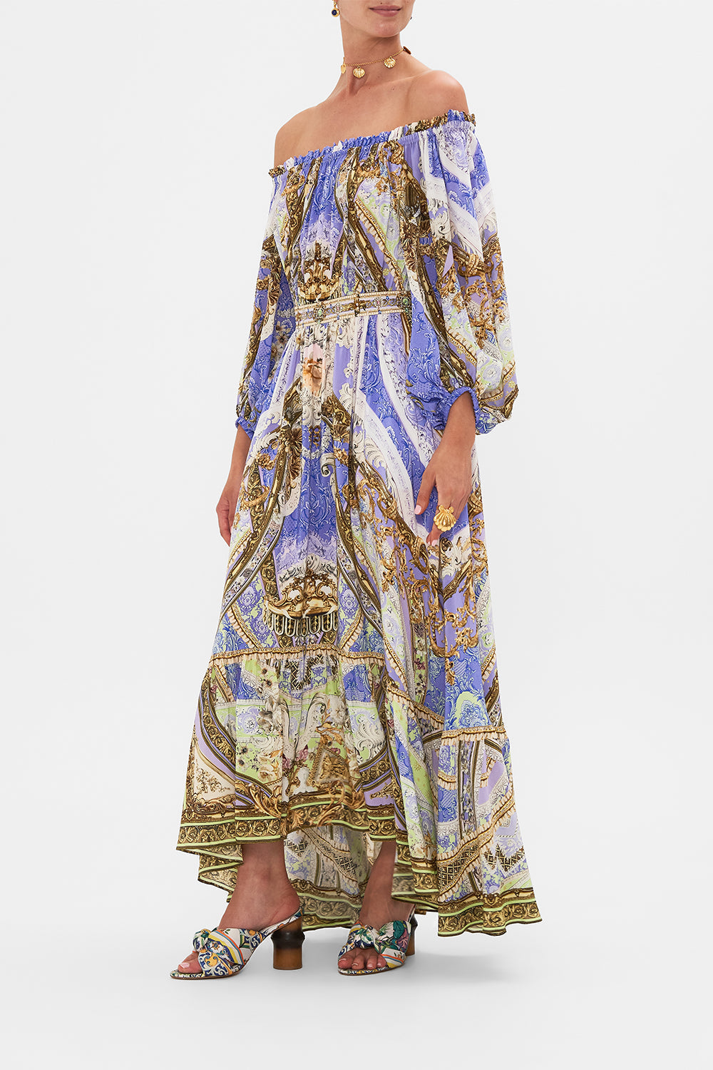 Side view of model wearing CAMILLA frill off the shoulder dress in Guilded Pleasures print 