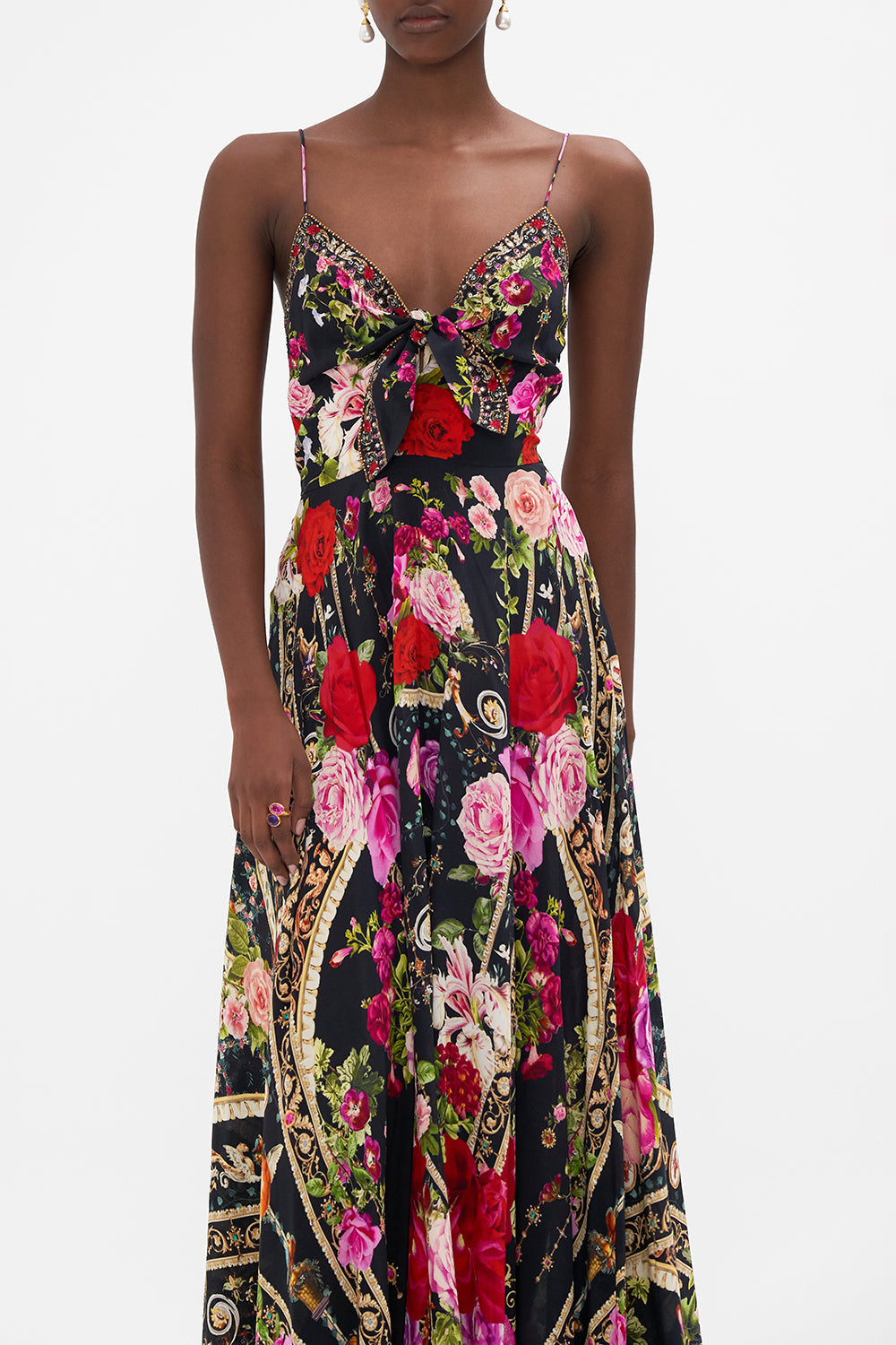 Crop view of model wearing CAMILLA floral silk maxi dress in Reservation For Love print 