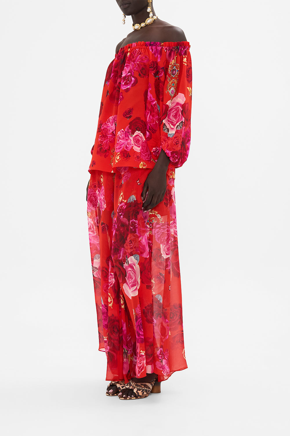 Side view of model wearing CAMILLA off the shoulder top in An Italian Rosa print