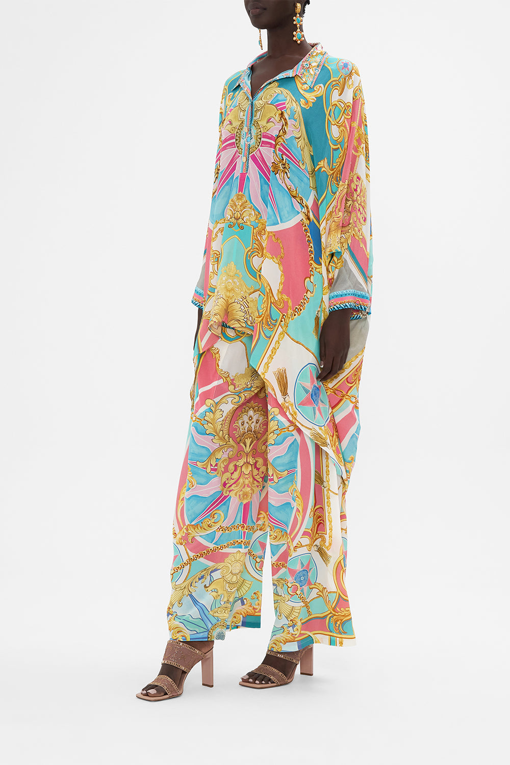 Side view of model wearing CAMILLA drape back top in Sail Away With me print 