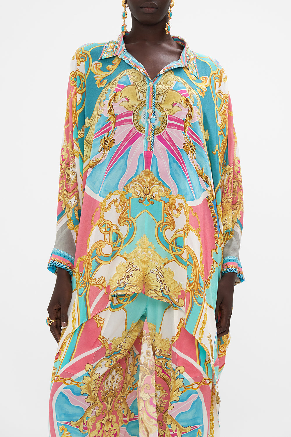 Crop view of model wearing CAMILLA drape back top in Sail Away With me print 