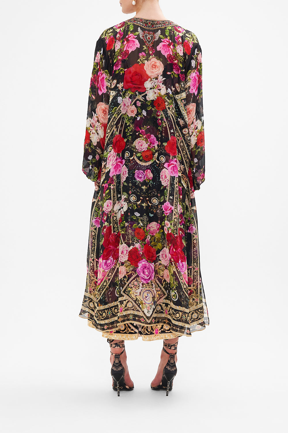 Back view of model wearing CAMILLA silk kimono layer in Reservation For Love print 