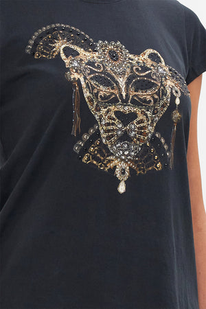 Detail view of model wearing CAMILLA luxury t shirt in Masked At Moonlight print