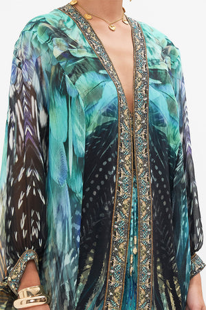 Detail view of model wearing CAMILLA silk kimono layer in Azure Allure print