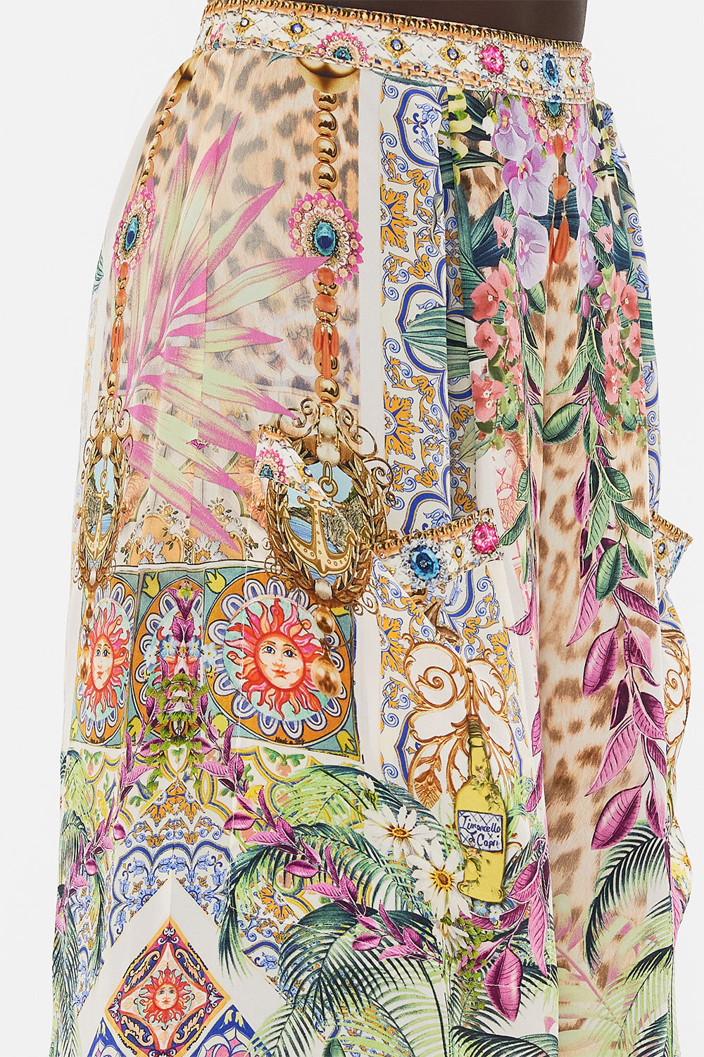 Detail view of model wearing CAMILLA floral silk pants in Flowers Of Neptune print 