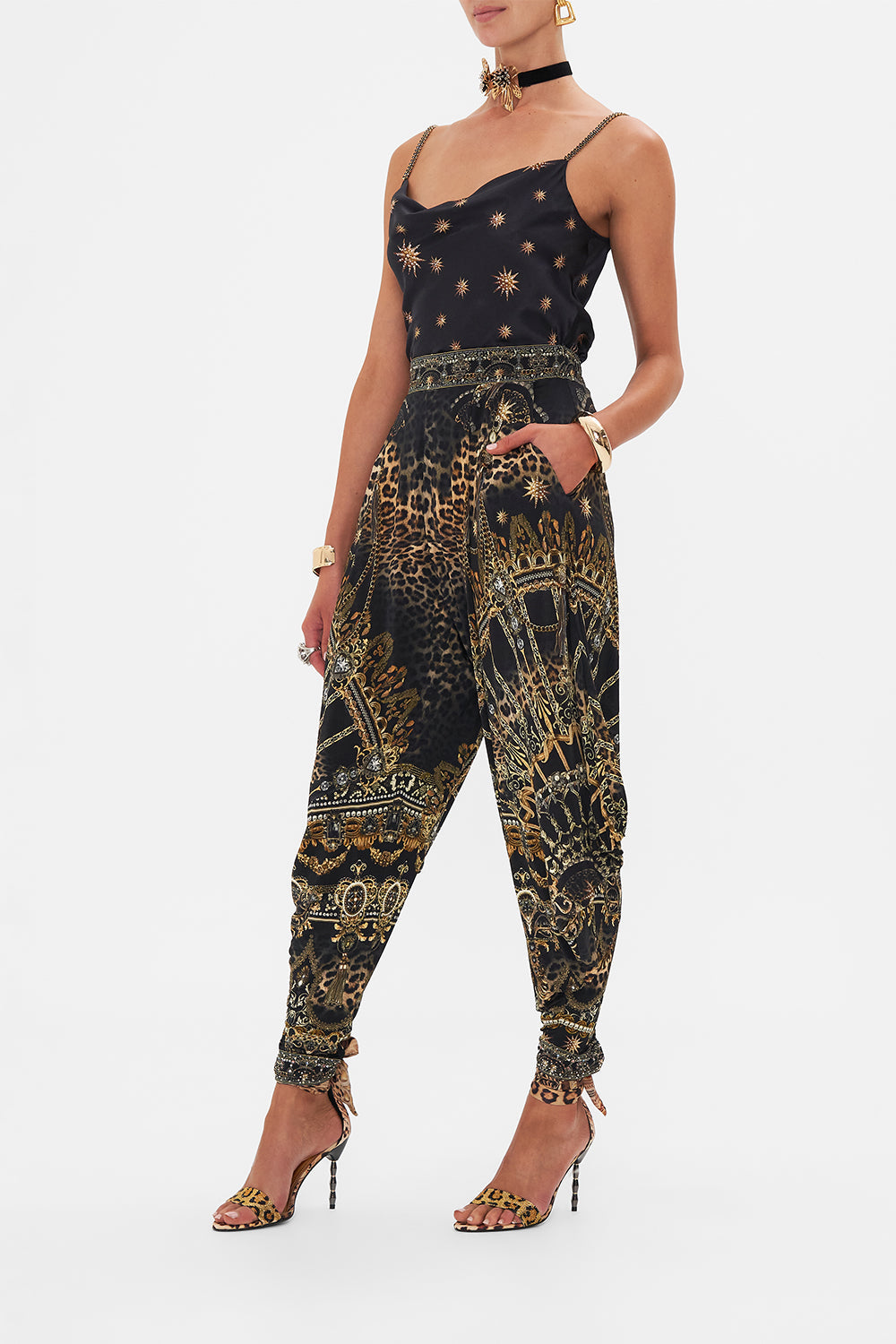 Side view of model wearing CAMILLA jersey draped pants in Masked At Moonlight print 