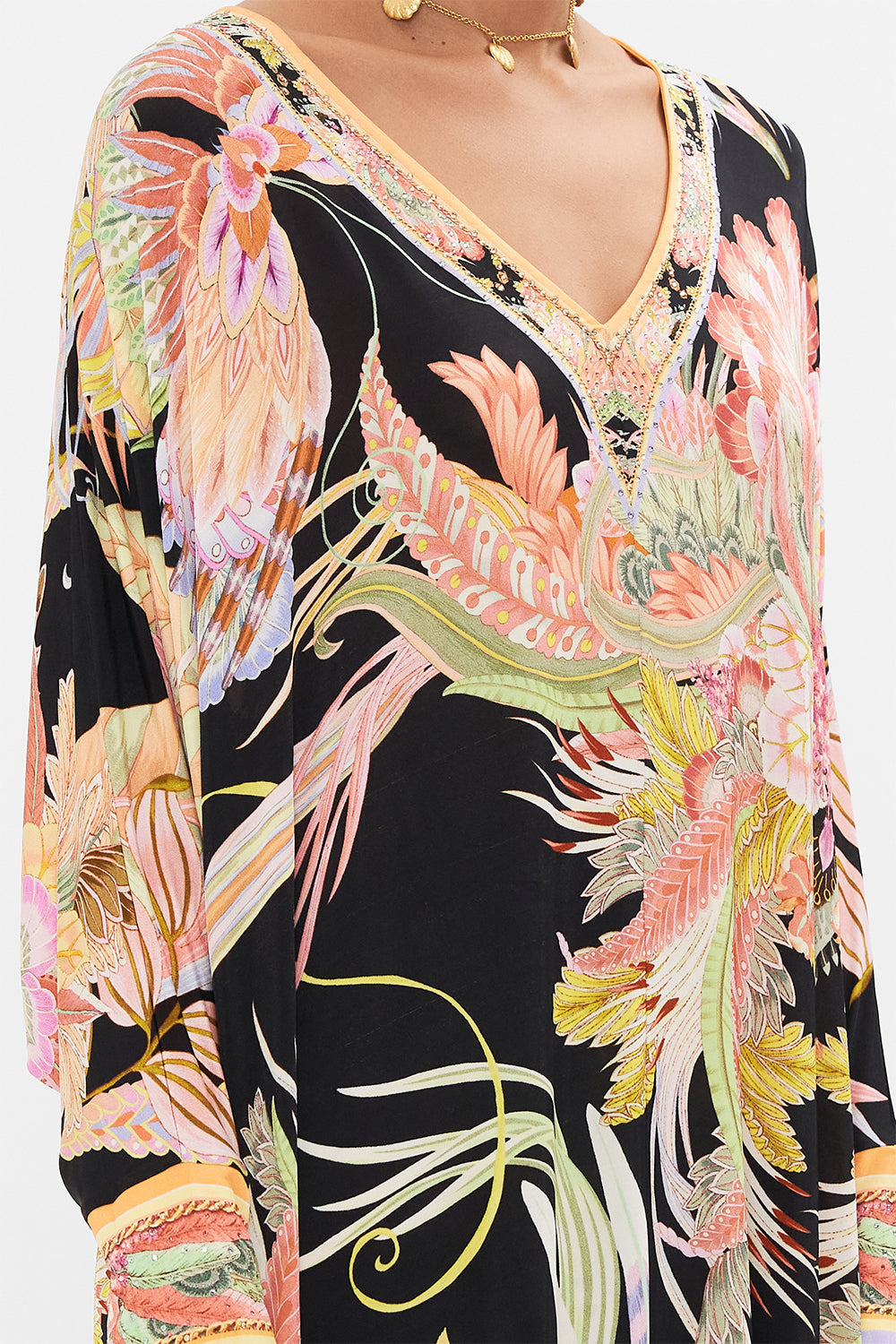 Detail view of model wearing CAMILLA designer jersey kaftan in Lady of The Moon print