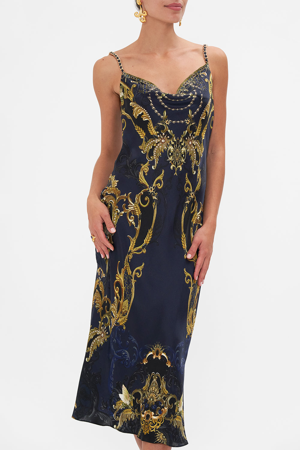 Crop view of model wearing CAMILLA bias silk slip dress in Moonlight Melodies print