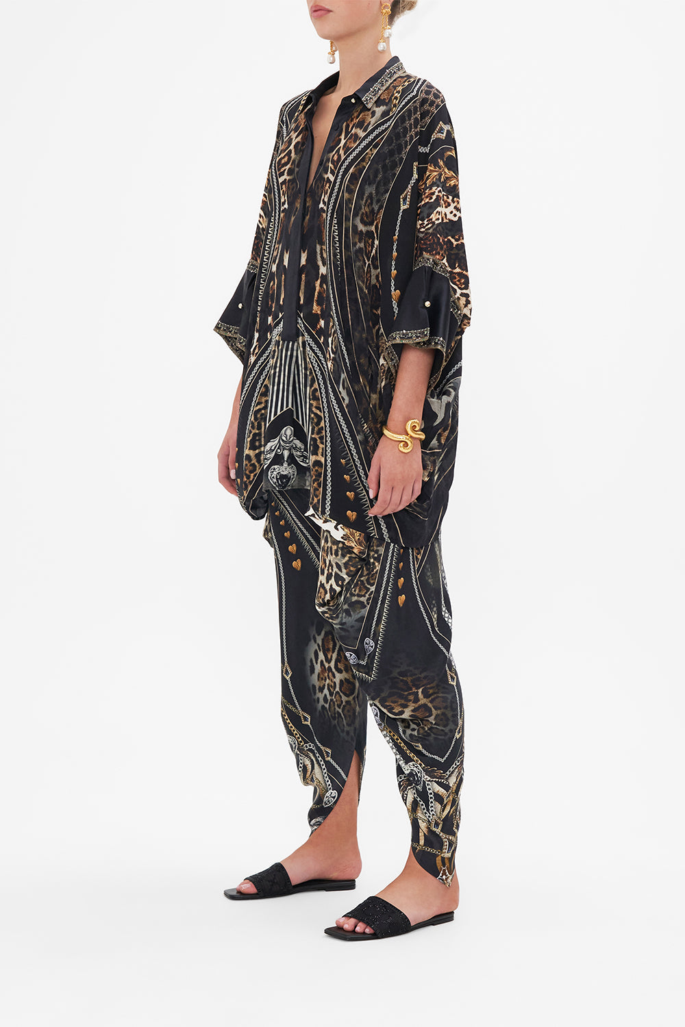 Side view of model wearing CAMILLA silk shirt in Chaos In The Cosmos animal print