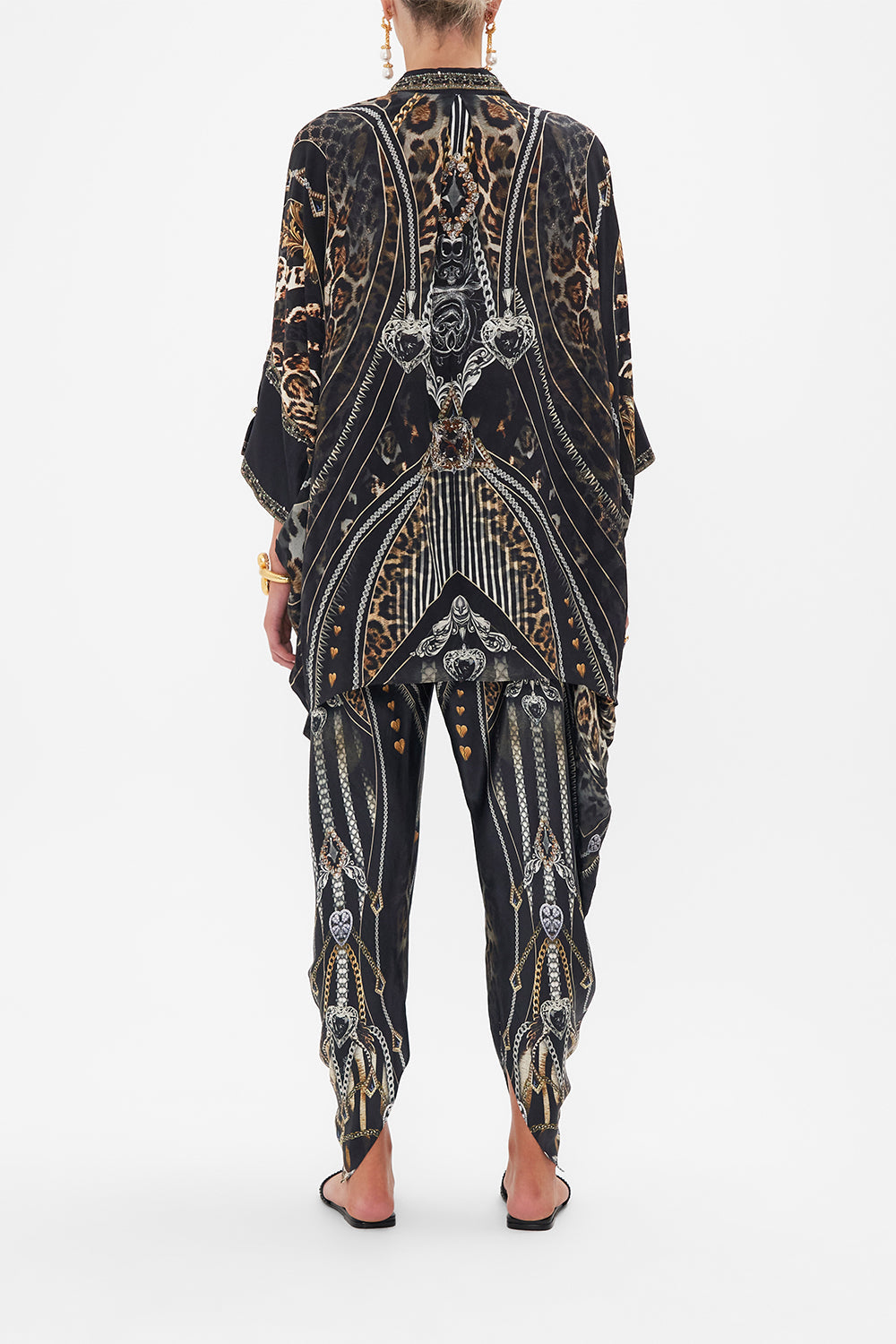 Back view of model wearing CAMILLA silk shirt in Chaos In The Cosmos animal print