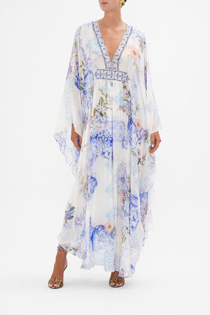 Front view of model wearing CAMILLA white and blue floral silk kaftan in Paint Me Positano print