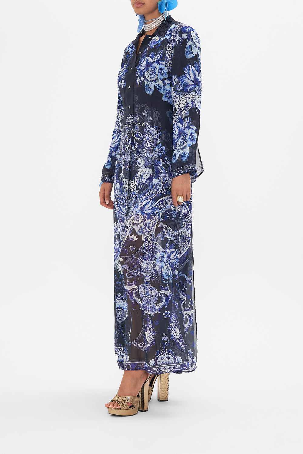 Crop view of model wearing CAMILLA silk trench in Delft Dynasty print