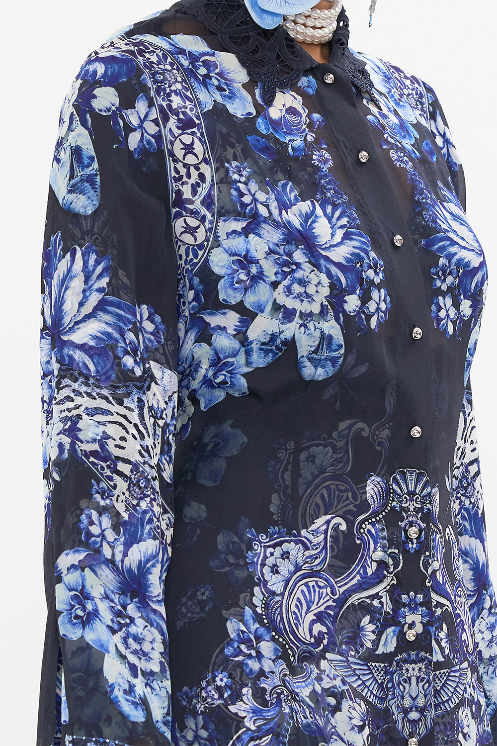 Detail view of model wearing CAMILLA silk trench in Delft Dynasty print