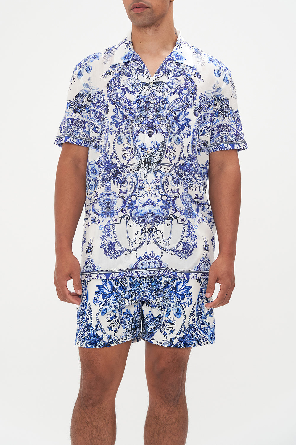 Crop view of model wearing Hotel Franks By CAMILLA mens blue and white shirt in Glaze and Graze print