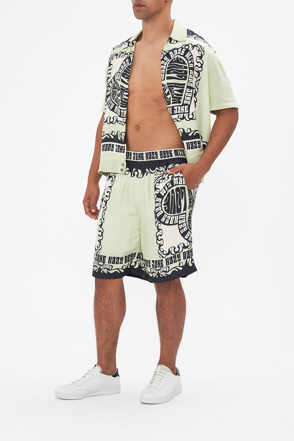 The CAMILLA COAT WITH WIDE CUFFS AND SHORT SIDE SPLITS TAPESTRY TOTEMS in our  print.