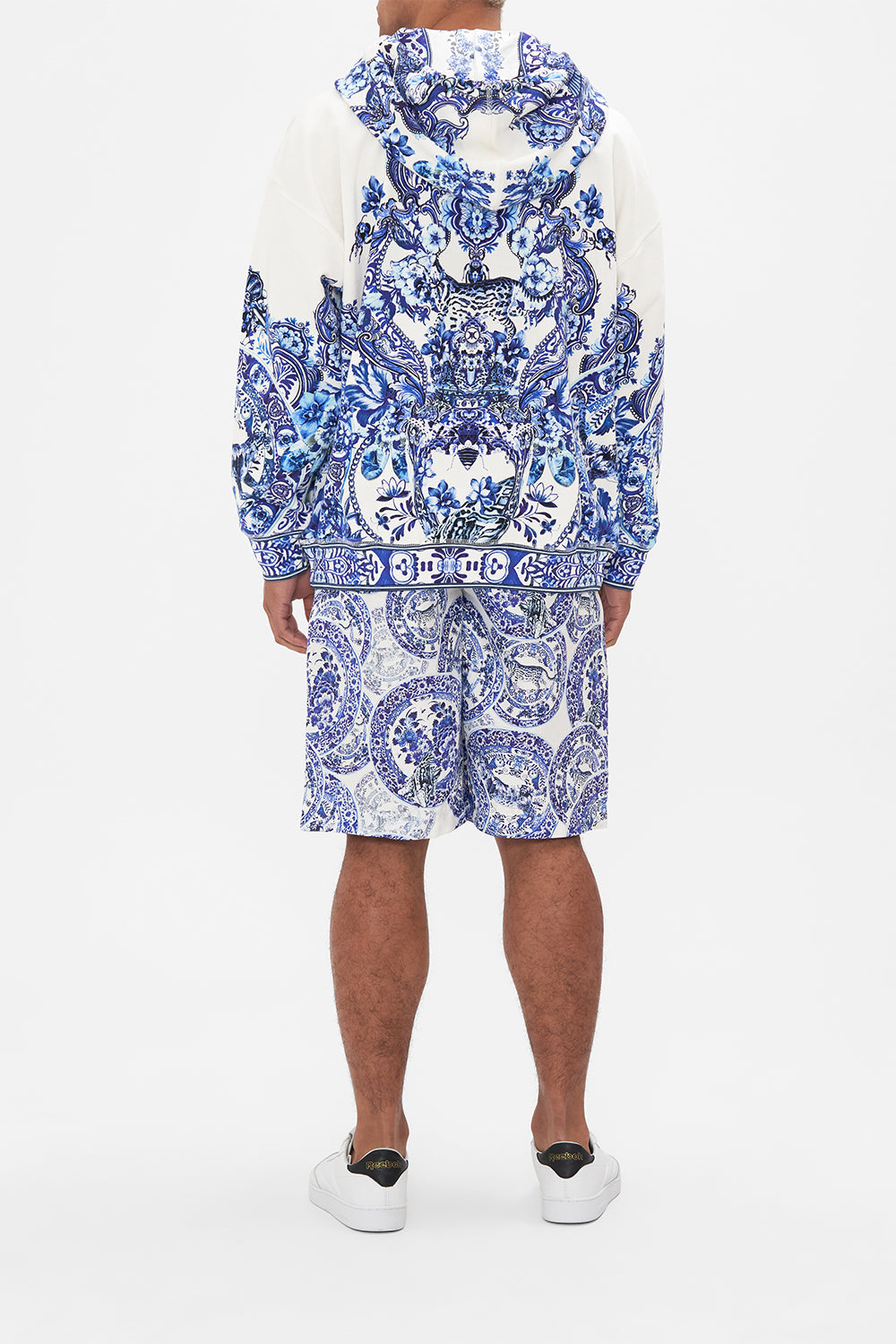 Back view of model wearing Hotel Franks by CAMILLA mens oversized hoodie in Glaze and Graze print