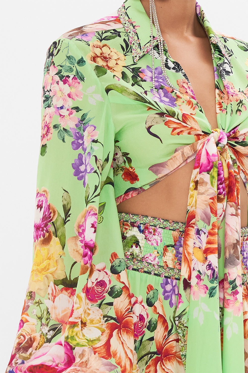 Detail view of model wearing CAMILLA wrap shirt in Porcelain Dream print