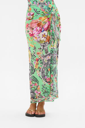 Crop view of model wearing CAMILLA resort wear long sarong in Porcelain Dream print