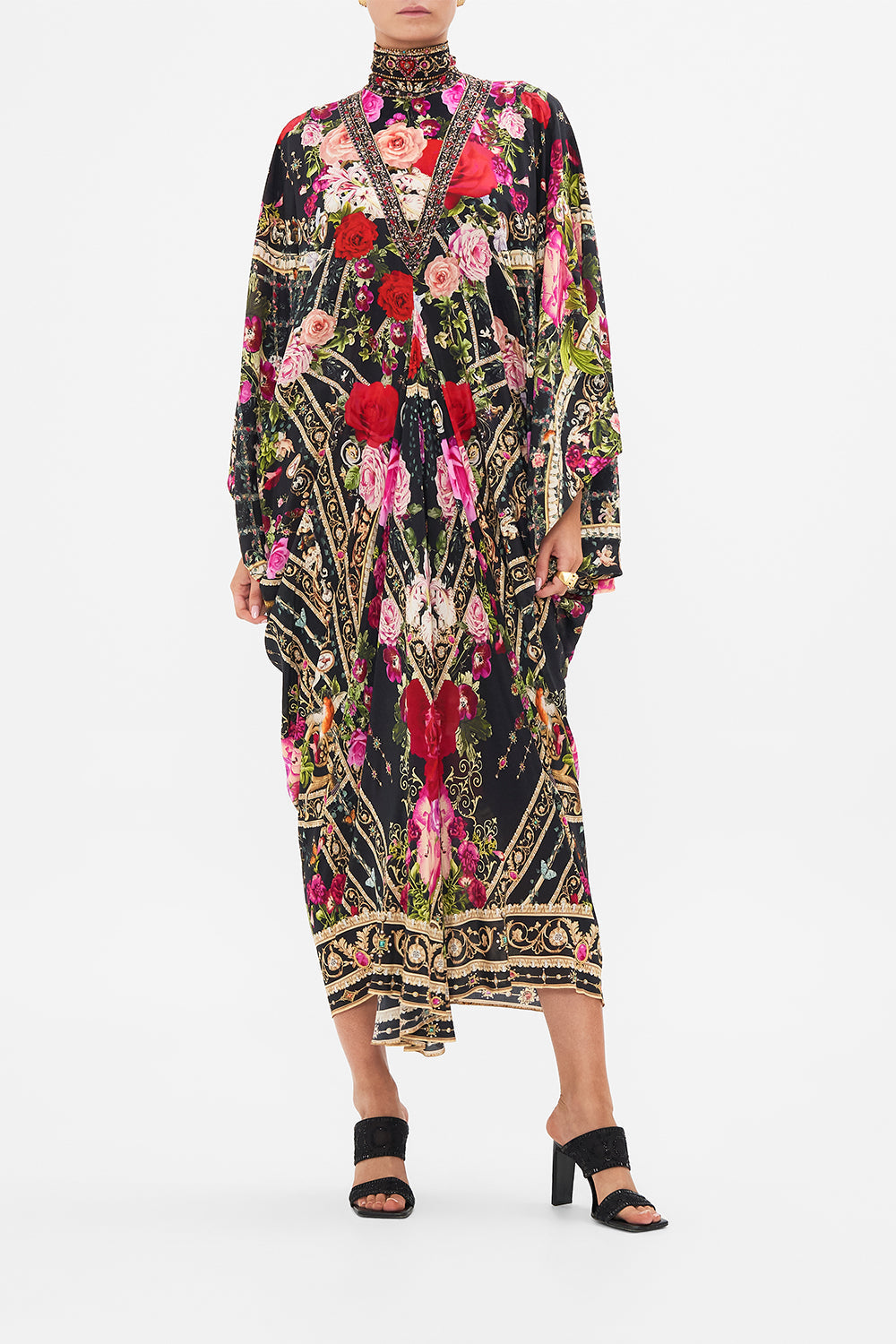 Crop view of model wearing CAMILLA  designer resort wear silk kaftan print in Reservation For Love print 